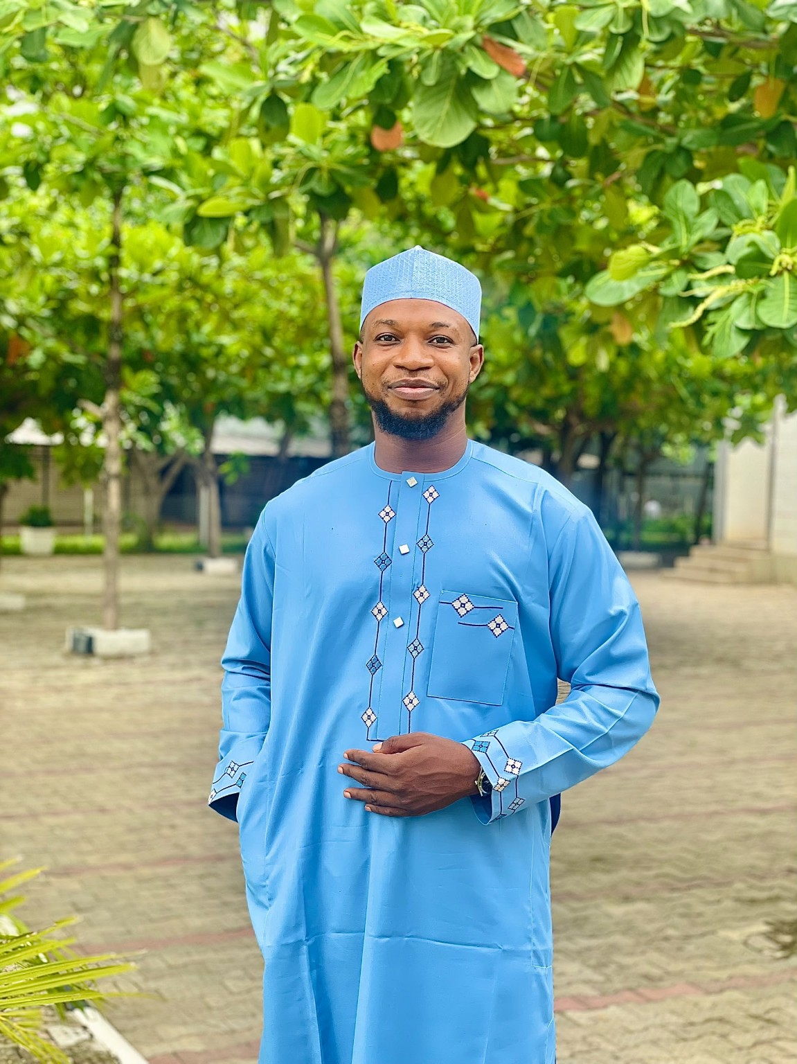 Idowu Tobi Aniyikaiye in blue Nigerian traditional attire