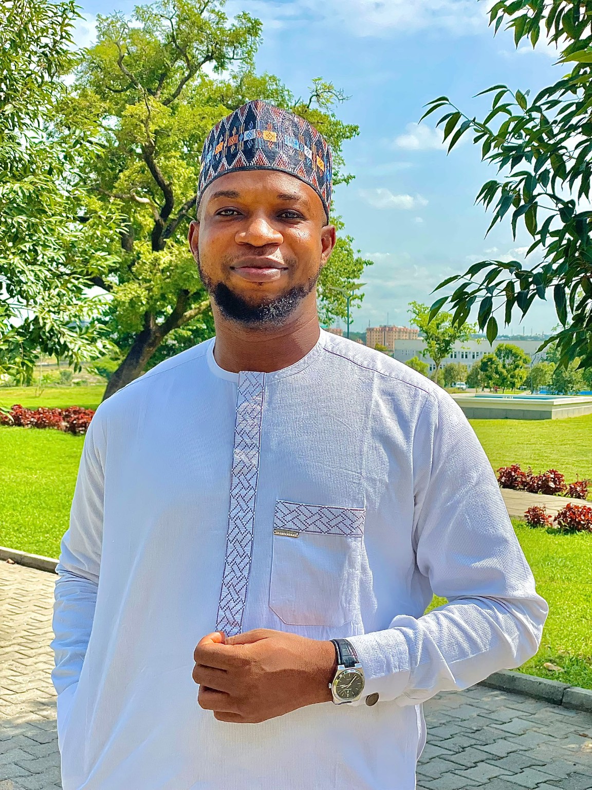 Portrait outdoors in light blue traditional attire