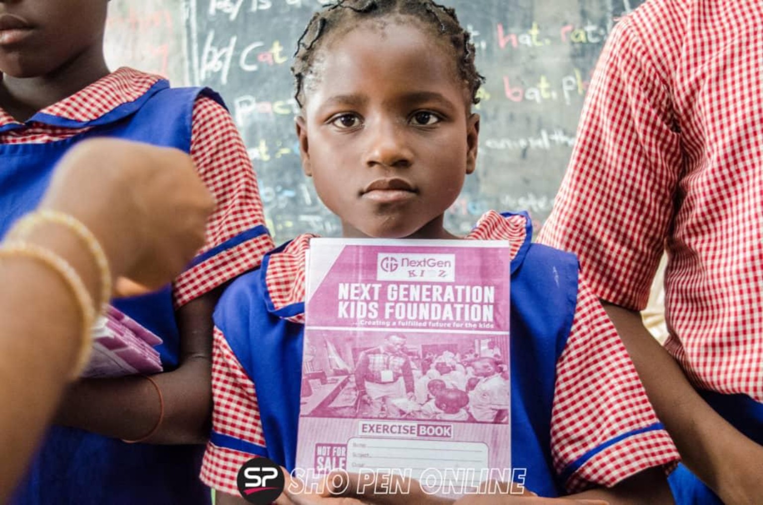 Student holding a school item