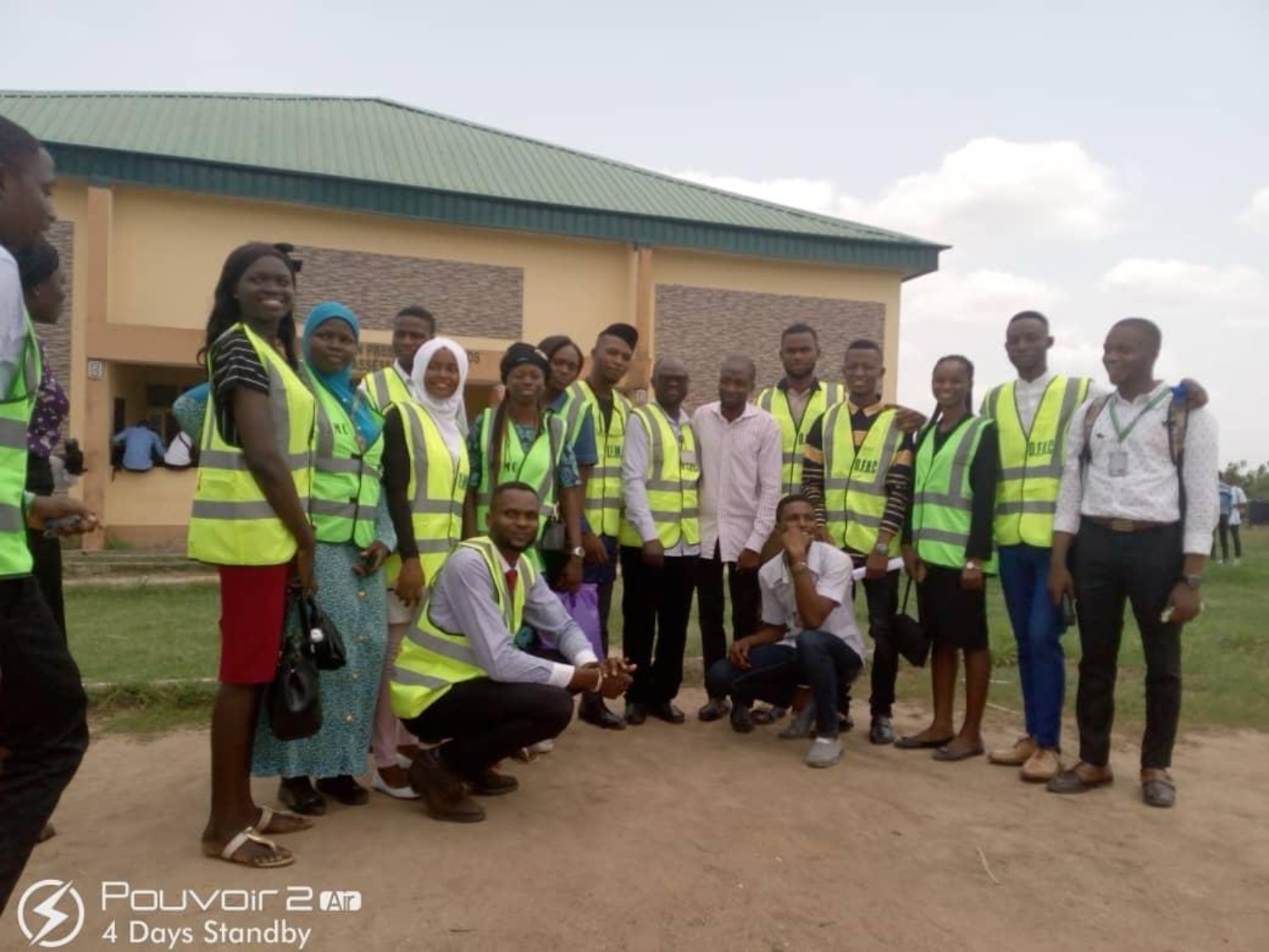 Community volunteers outside a building