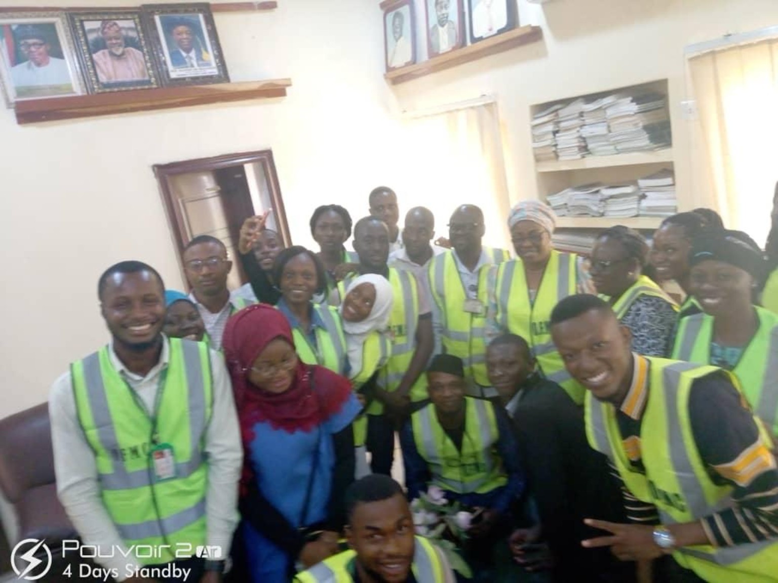 Group portrait of community volunteers indoors
